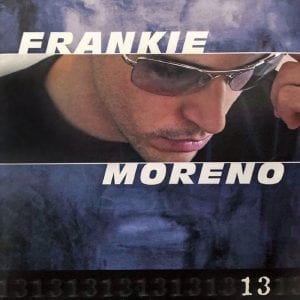 A man in sunglasses looks down, with "FRANKIE" above and "MORENO" below, on a blue background.