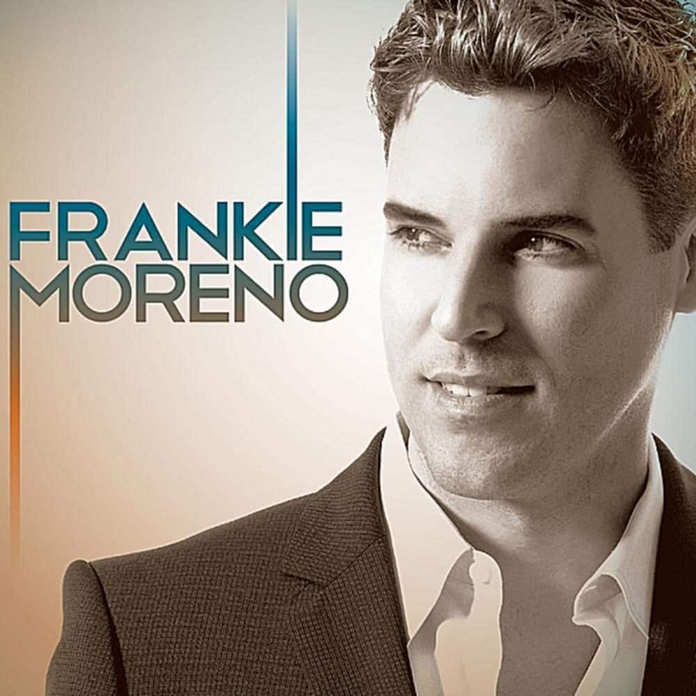Frankie Moreno A man in a suit jacket and white shirt smiles, looking right, with "FRANKIE MORENO" on the left.