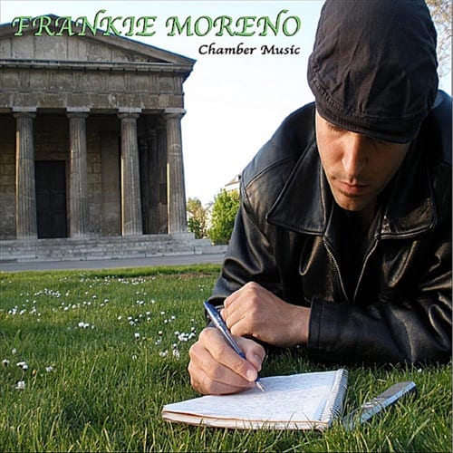 chamber A man in a black jacket and cap writes in a notebook on grass, with "FRANKIE MORENO Chamber Music" and a stone building in the background.