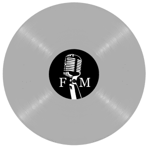 A light gray vinyl record with a black center label featuring a white vintage microphone and the text "F M".