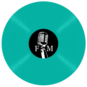A teal vinyl record has a black label with a white vintage microphone and the letters "F M".