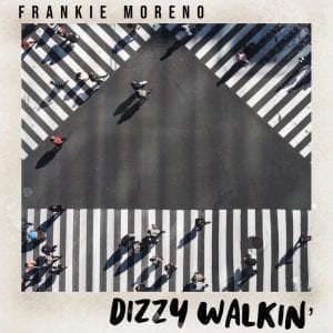 An aerial view of people walking on a crosswalk with "FRANKIE MORENO" and "DIZZY WALKIN'" text.