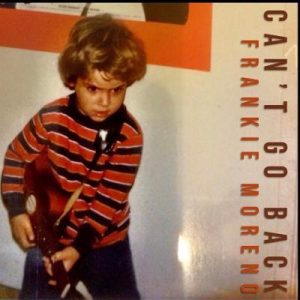 A young boy with brown hair and a striped shirt holds a guitar, with "CAN'T GO BACK FRANKIE MORENO" vertically on the right.