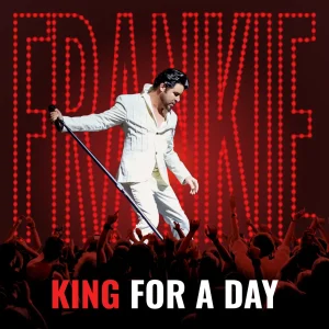 A man in a white suit sings into a microphone on stage with "FRANKIE" in red lights and "KING FOR A DAY" below.