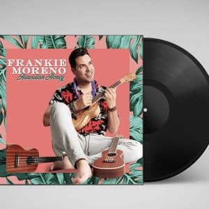 A vinyl record and album cover for "Frankie Moreno Hawaiian Honey" featuring a man playing a ukulele.